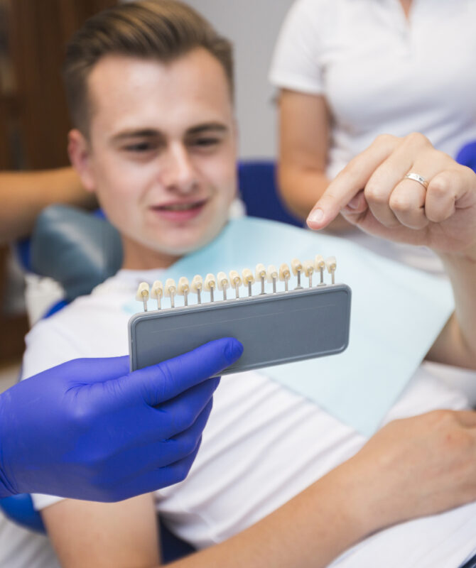 patient-pointing-teeth-with-dentist